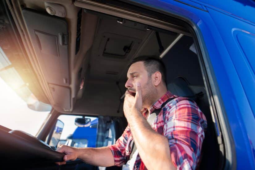 Truck driver yawning due to fatigue
