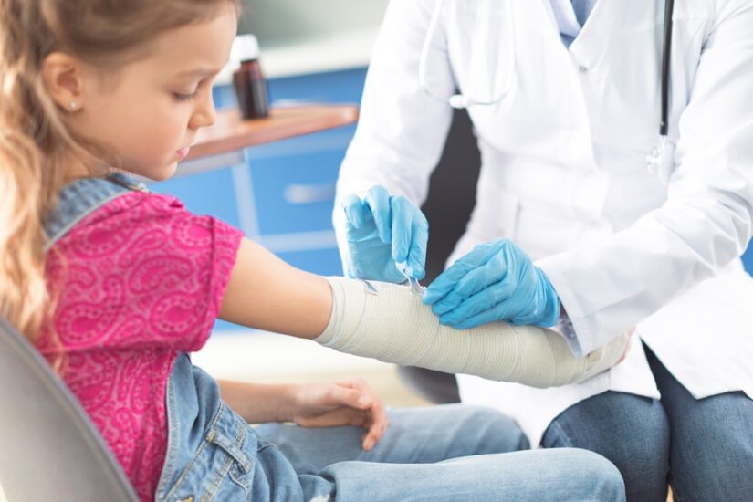 Child Getting Bandaged Arm