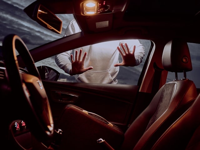 People Putting Hands On A Car Window