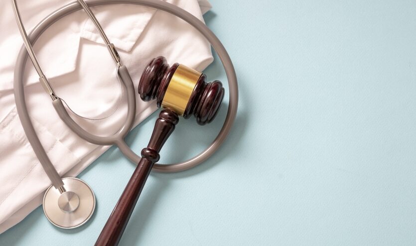 Gavel and stethoscope on the table