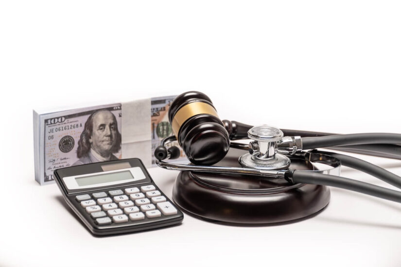 Malpractice litigation Gavel, money, and stethoscope symbolizing medical malpractice litigation