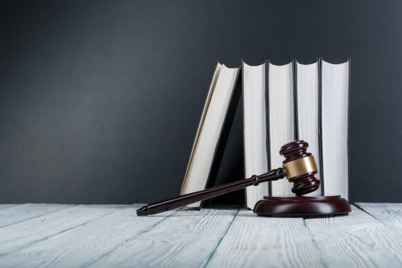Law book with wooden judge image Law book with wooden judge image