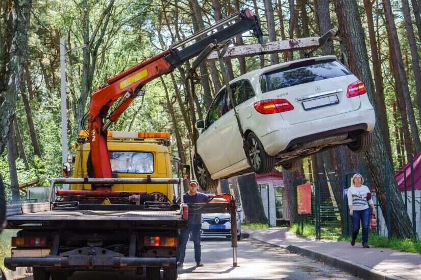Vehicle is being loaded on a truck